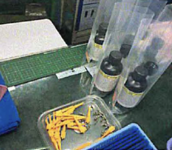 Bottles being processed at kitting stage.