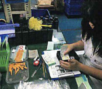 A worker doing Labeling.